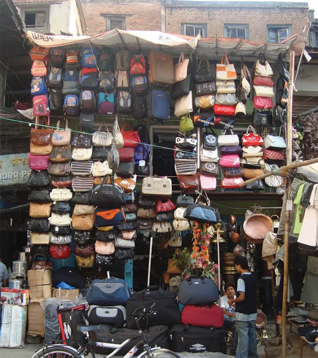 A bag shop in Nepal, its front hung with hundreds of bags
